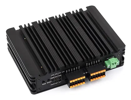 Industrial gateway hardware with a finned metal enclosure, terminal connections and a green connector